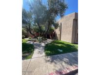 Building exterior with walkway and landscaping at 3131 W Cochise Dr # 165, Phoenix, AZ 85051