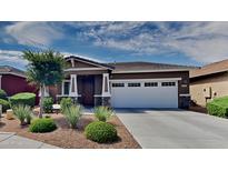 Single-story home with two-car garage and desert landscaping at 3743 E Aspen Ave, Mesa, AZ 85206