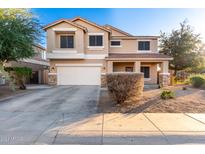 Two-story house with a large front yard and driveway at 7017 W Branham Ln, Laveen, AZ 85339