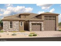 Two-story home with stone and stucco exterior, two-car garage, and landscaping at 17597 W Blue Sky Dr, Surprise, AZ 85387