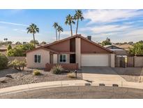 Single-story home with a two-car garage and desert landscaping at 17638 N 36Th Ave, Glendale, AZ 85308