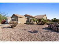 Single-story home with desert landscaping and a two-car garage at 2035 S 86Th Ln, Tolleson, AZ 85353