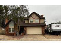 Two-story house with attached garage and RV parking at 12016 N 61St Ave, Glendale, AZ 85304