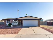 Single story home with a two-car garage and well-maintained landscaping at 17621 N 18Th Dr, Phoenix, AZ 85023