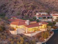 Hillside home with terracotta roof and large windows at 3800 E Lincoln Dr # 55, Phoenix, AZ 85018