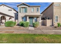 Two-story house with green door and landscaping at 3718 S 58Th Dr, Phoenix, AZ 85043