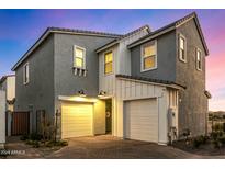 Two-story home with gray siding, white trim, and a two-car garage at 4746 S Ferric --, Mesa, AZ 85212