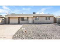 Single story home with attached garage and gravel landscaping at 6219 S 12Th Pl, Phoenix, AZ 85042