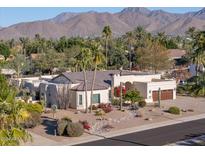 Single-story home with desert landscaping; mountain views at 11142 E Sorrel Ln, Scottsdale, AZ 85259