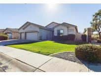 Single-story home with a two-car garage and well-maintained landscaping at 3917 E Dubois Ave, Gilbert, AZ 85298