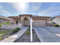 Single-story home with a two-car garage and landscaped front yard at 11543 E Starkey Ave, Mesa, AZ 85212