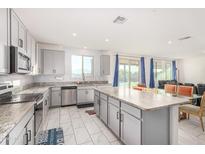 Spacious kitchen with granite countertops and stainless steel appliances at 2439 W Kowalsky Ln, Phoenix, AZ 85041