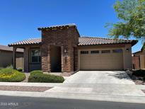 One-story home with brick accents and a two-car garage at 2816 W Pollack St, Phoenix, AZ 85041