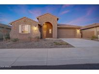 Beautiful one-story home with a tile roof, and landscaped front yard at 18322 W Long Lake Rd, Goodyear, AZ 85338