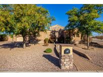 Craftsman style home with stone accents and mature landscaping at 2796 E Meadowview Ct, Gilbert, AZ 85298