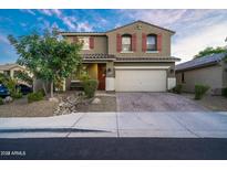 Two-story house with a landscaped front yard and a brick driveway at 2811 E Dunbar Dr, Phoenix, AZ 85042
