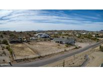 Aerial view of a house with a large yard and horse corral at 28667 N Hundley Hts, San Tan Valley, AZ 85144