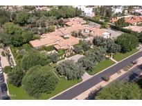 Aerial view of a luxurious estate with extensive landscaping and mountain views at 6240 N 59Th Pl, Paradise Valley, AZ 85253