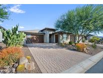 Single-story home with desert landscaping and a paved driveway at 17910 E Cindercone Rd, Rio Verde, AZ 85263