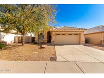 Single-story house with a two-car garage and desert landscaping at 11937 N 110Th Way, Scottsdale, AZ 85259