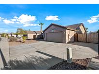 House exterior with driveway and desert landscaping at 13253 W Paradise Ln, Surprise, AZ 85374