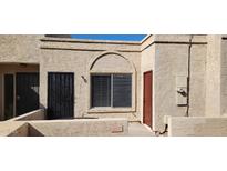 Exterior view of condo with front door and window at 20237 N 21St Ln, Phoenix, AZ 85027