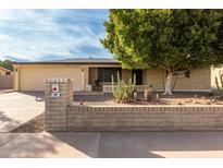 Ranch-style home with a well-maintained yard and desert landscaping at 666 N 65Th Pl, Mesa, AZ 85205