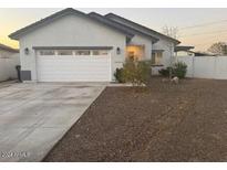 Modern house exterior with a two-car garage and small front yard at 16244 N 27Th Pl, Phoenix, AZ 85032
