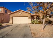 One-story house with a two-car garage and desert landscaping at 282 E Dry Creek Rd, San Tan Valley, AZ 85143