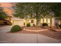 Beautiful desert landscape surrounds this single-story home with a three-car garage at 29411 N 123Rd Ln, Peoria, AZ 85383