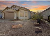 Charming single-story home with desert landscaping and attached two-car garage at 8339 W Bluefield Ave, Peoria, AZ 85382