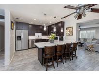 Modern kitchen with stainless steel appliances and an island at 3547 E Monterosa St, Phoenix, AZ 85018