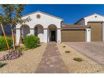 Stunning curb appeal! This home features a charming exterior, a brick walkway and landscaping at 13930 W Tierra Grande --, Surprise, AZ 85387