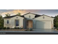 Single-story home with Spanish-style architecture, two-car garage, and desert landscaping at 17762 W Windsor Blvd, Avondale, AZ 85392