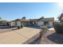 Ranch style home with a well-maintained front yard and driveway at 4235 E Hano St, Phoenix, AZ 85044