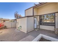 Private patio with brick pavers and access to a storage unit at 3120 N 67Th Ln # 47, Phoenix, AZ 85033
