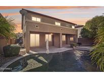 Home features a large pool and patio, perfect for entertaining at 16048 W Mercer Ln, Surprise, AZ 85379