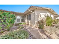 Tan exterior with walkway leading to front entrance at 17453 N Boswell Blvd, Sun City, AZ 85373