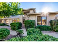 Well-maintained home with attractive landscaping and a welcoming entryway at 20205 N Broken Arrow Dr, Sun City West, AZ 85375