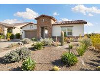 Spanish style home with a landscaped front yard at 4779 N 205Th Gln, Buckeye, AZ 85396