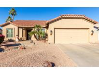 One-story house with tan exterior, tile roof, and two-car garage at 1450 E Buena Vista Dr, Chandler, AZ 85249