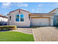 One-story home with a two-car garage and landscaped front yard at 30855 N 138Th Ave, Peoria, AZ 85383