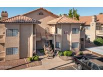 Front view of a two-story building with Spanish-style architecture at 930 N Mesa Dr # 1097, Mesa, AZ 85201