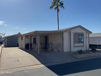 Mobile home exterior with covered patio and desert landscaping at 5735 E Mcdowell Rd # 198, Mesa, AZ 85215