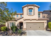 Two-story house with desert landscaping and two-car garage at 1864 W Buckhorn Trl, Phoenix, AZ 85085