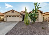 Single-story home with desert landscaping and a two-car garage at 3780 S Ashley Pl, Chandler, AZ 85286