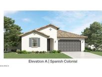 Spanish Colonial style home with gray garage door and landscaping at 3222 S Piedra Ave, Mesa, AZ 85212