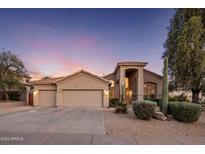 Beautiful desert landscape home with two-car garage and neutral-colored exterior at 4935 E Dale Ln, Cave Creek, AZ 85331