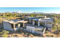 Luxury home with expansive desert views, featuring a modern design and private pool at 9983 E Mirabel Club Dr, Scottsdale, AZ 85262