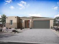 Single-story home with two-toned exterior, two-car garage, and desert landscaping at 26331 S 231St Way, Queen Creek, AZ 85142